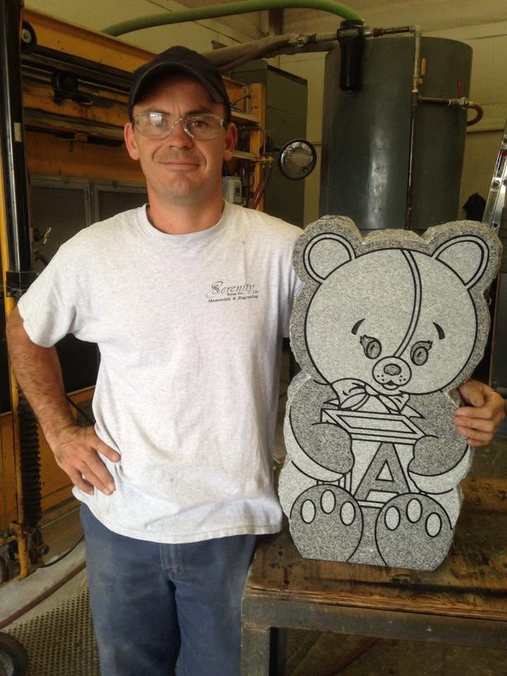 Adam with bear memorial sculpture