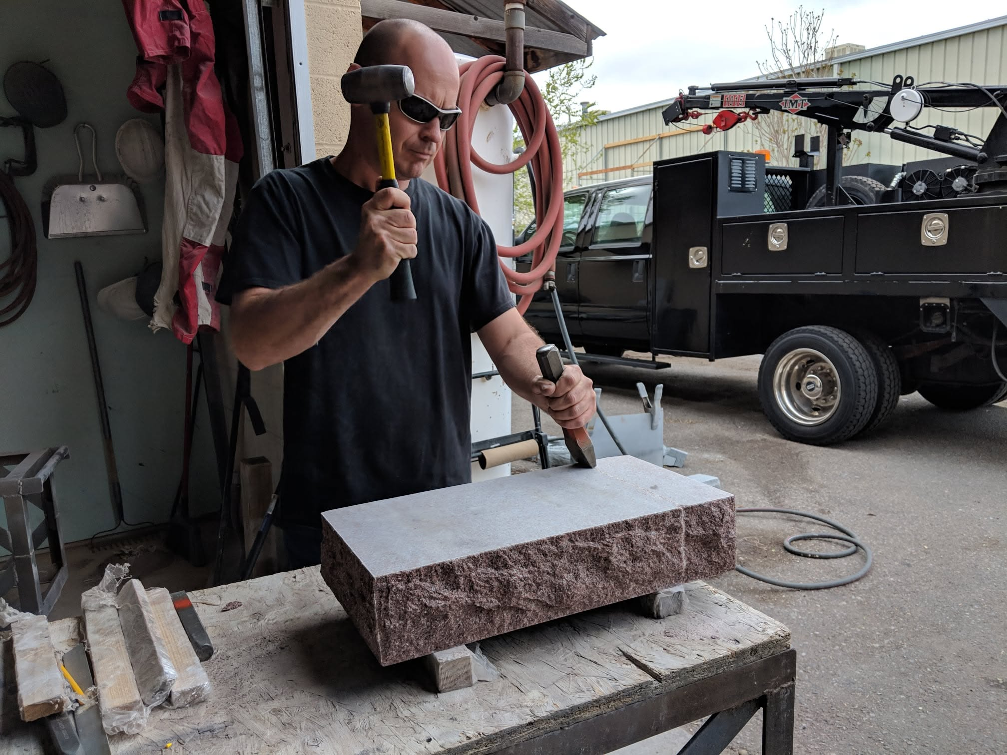 Adam chiseling outdoors