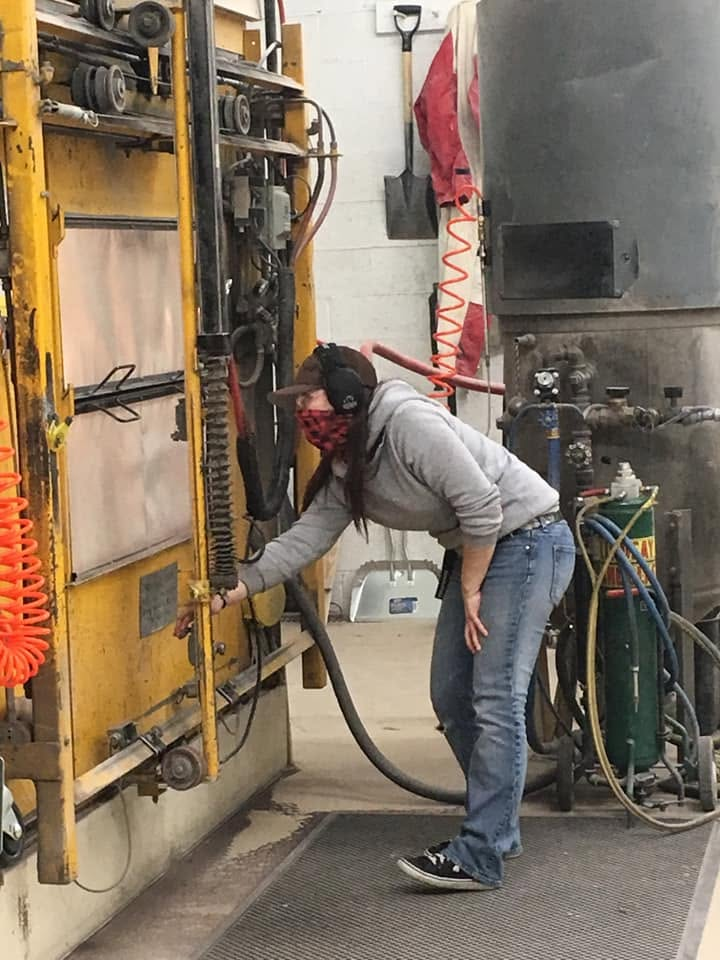 Tiffany laying out rubber on upright