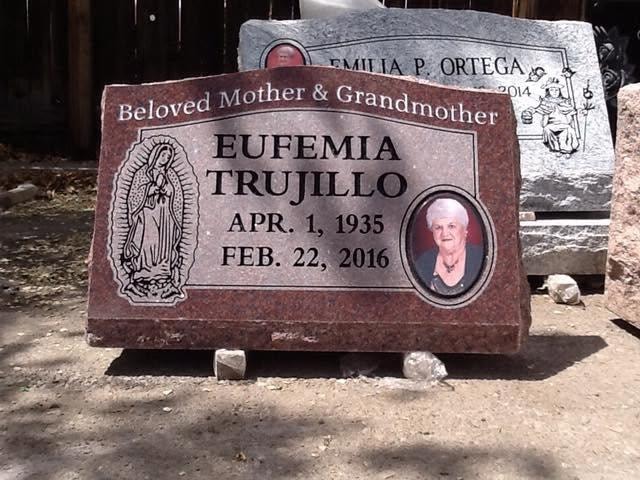 Eufemia Trujillo red granite slant with Our Lady of Guadalupe engraving porcelain photo tile Beloved Mother and Grandmother inscription Apr 1 1935 to Feb 22 2016