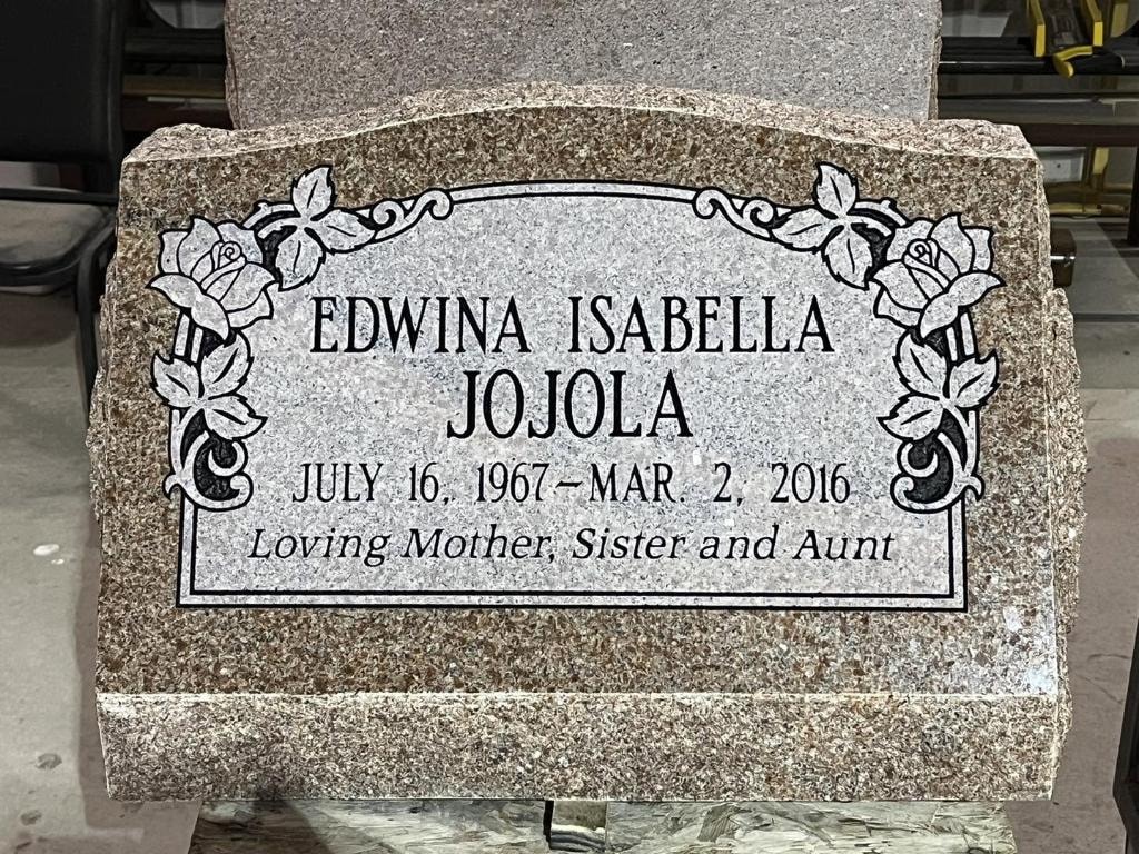 Edwina Isabella Jojola pink granite slant with engraved rose border frame and Loving Mother Sister and Aunt inscription