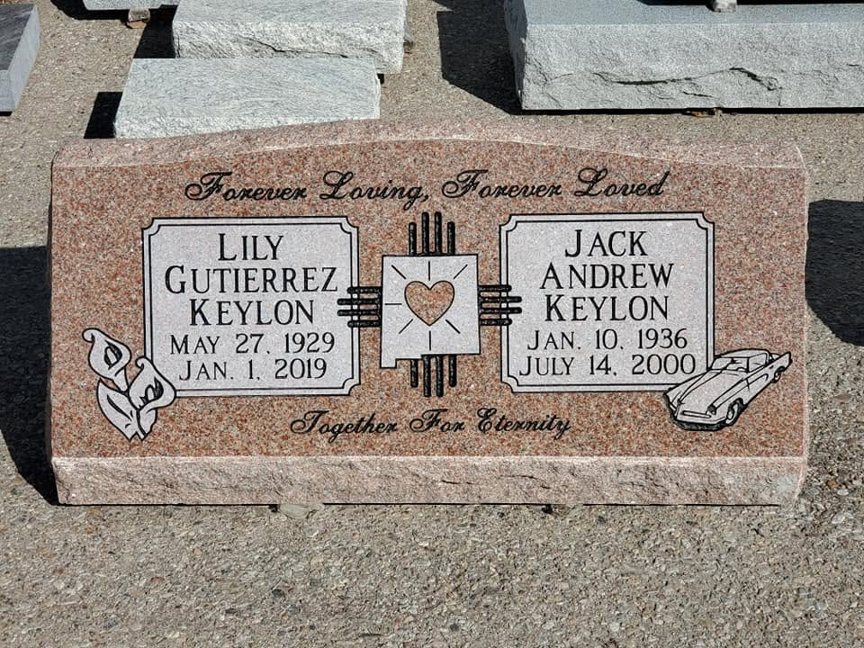 Lily and Jack Keylon companion pink granite slant with Zia heart symbol, engraved car, roses, and "Together For Eternity" inscription