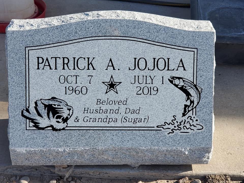 Patrick A. Jojola gray granite slant with engraved tiger fish and star Beloved Husband Dad and Grandpa Sugar inscription Oct 7 1960 to July 1 2019