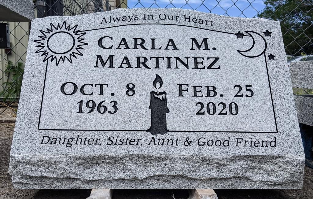 Carla M. Martinez gray granite slant with engraved sun moon stars and candle Always In Our Heart Daughter Sister Aunt and Good Friend inscription Oct 8 1963 to Feb 25 2020