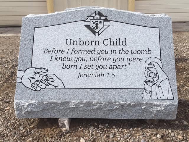 Unborn Child gray granite slant with Knights of Columbus emblem Madonna and Child engraving and Jeremiah 1:5 scripture Before I formed you in the womb I knew you